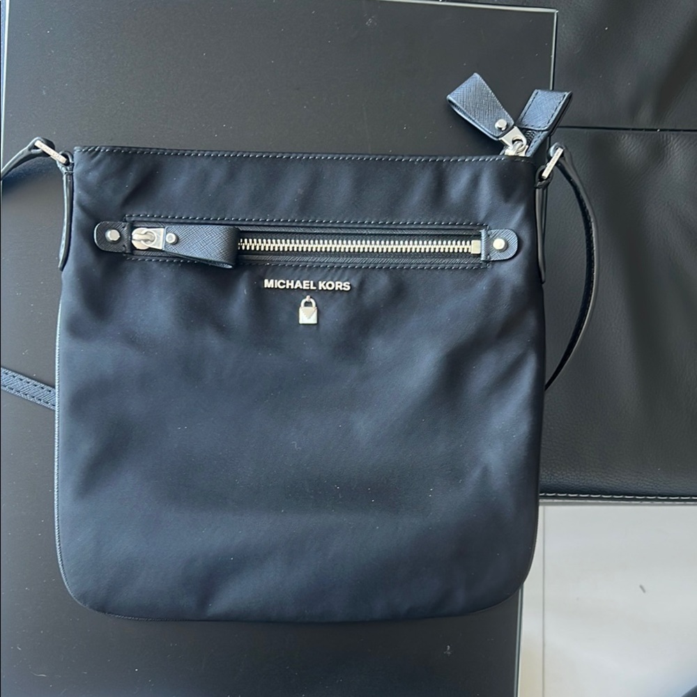 Michael Kors Black Messenger Bag with Adjustable Strap and Silver Accents